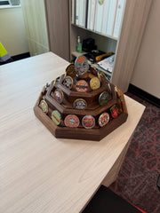 Finished three-tier black walnut challenge coin display photographed from the left, filled with challenge coins. Coins not included.